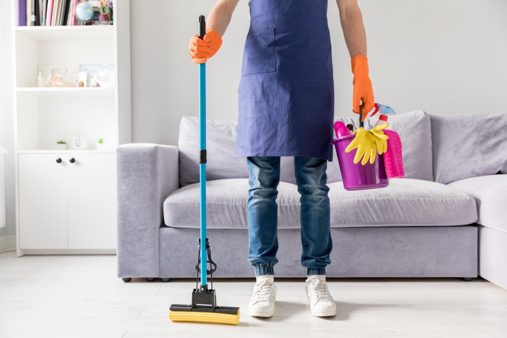 man cleaning his home